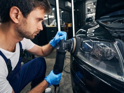 automobile-headlight-grinded-by-mechanic-with-polisher.jpg automobile-headlight-grinded-by-mechanic-with-polisher.jpg